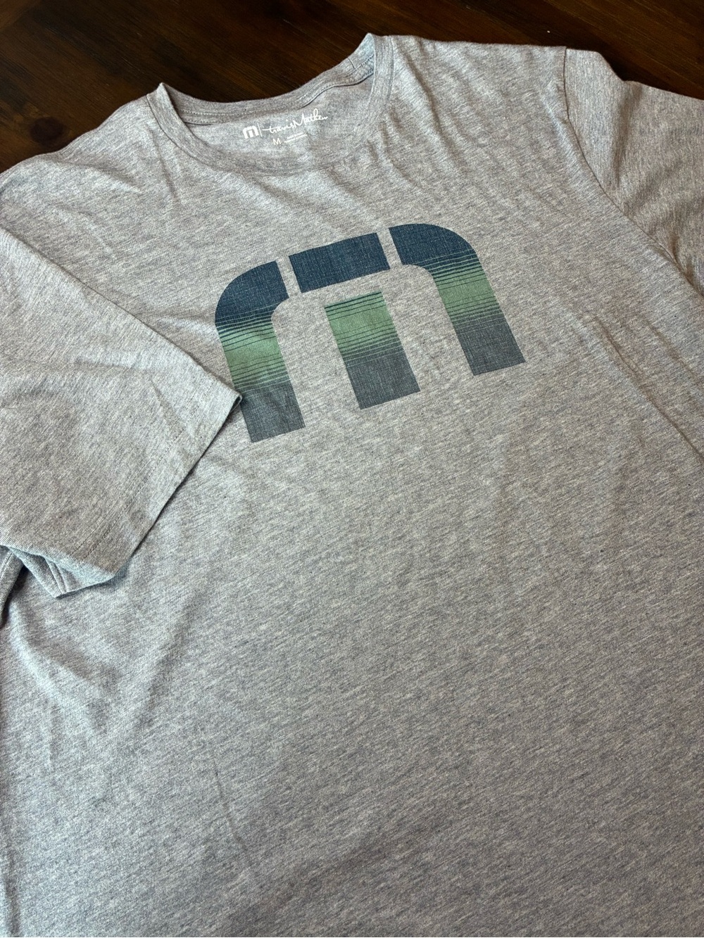 Travis, Matthew Men's Gray Graphic Tee with Green-Blue Logo